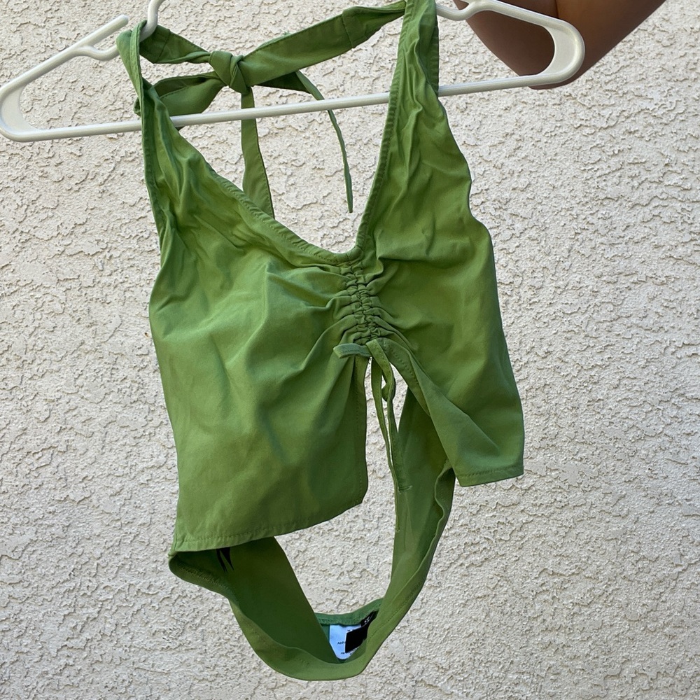 Tight green halter neck crop top